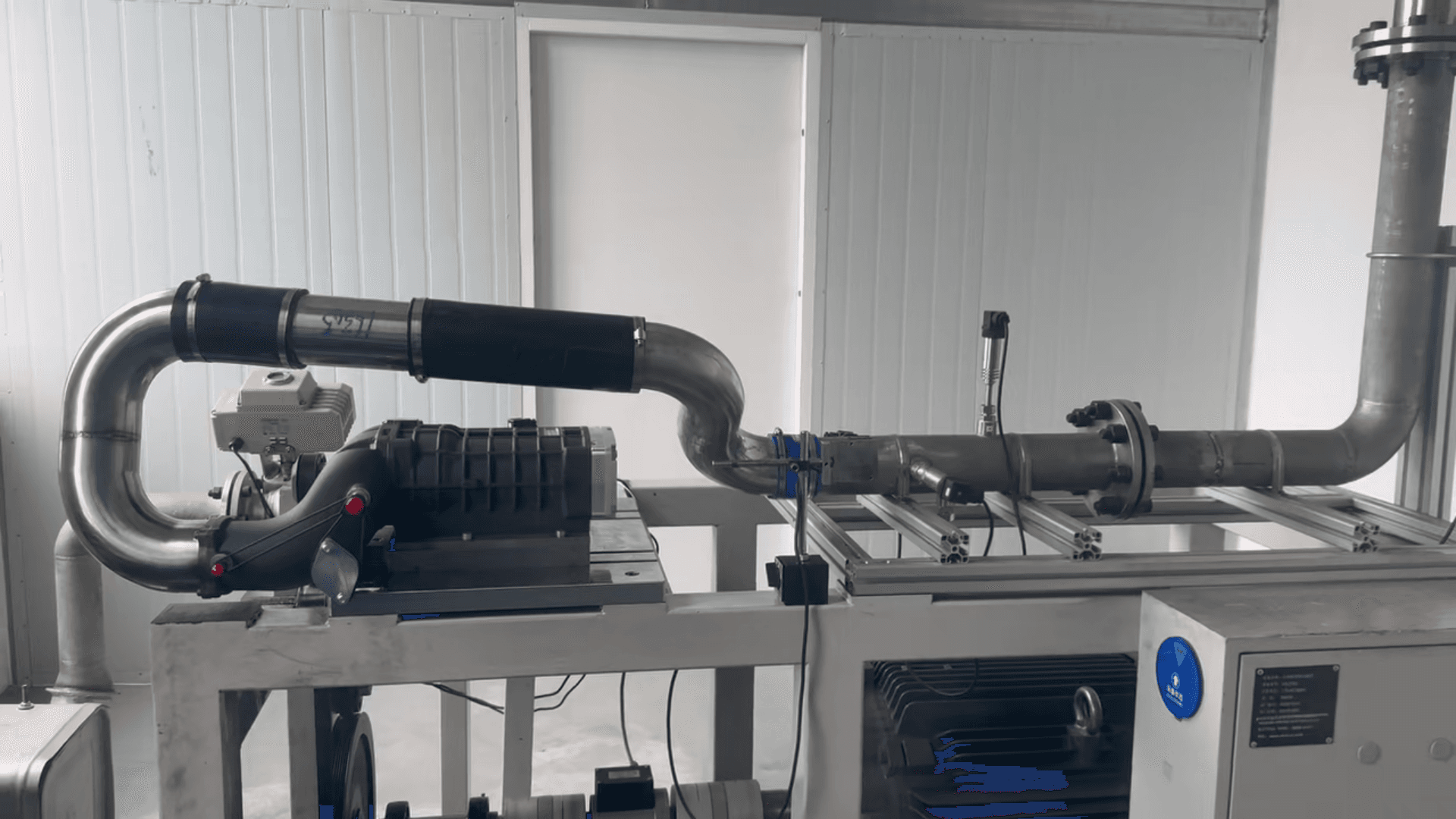 Supercharger system mounted on a bench test rig